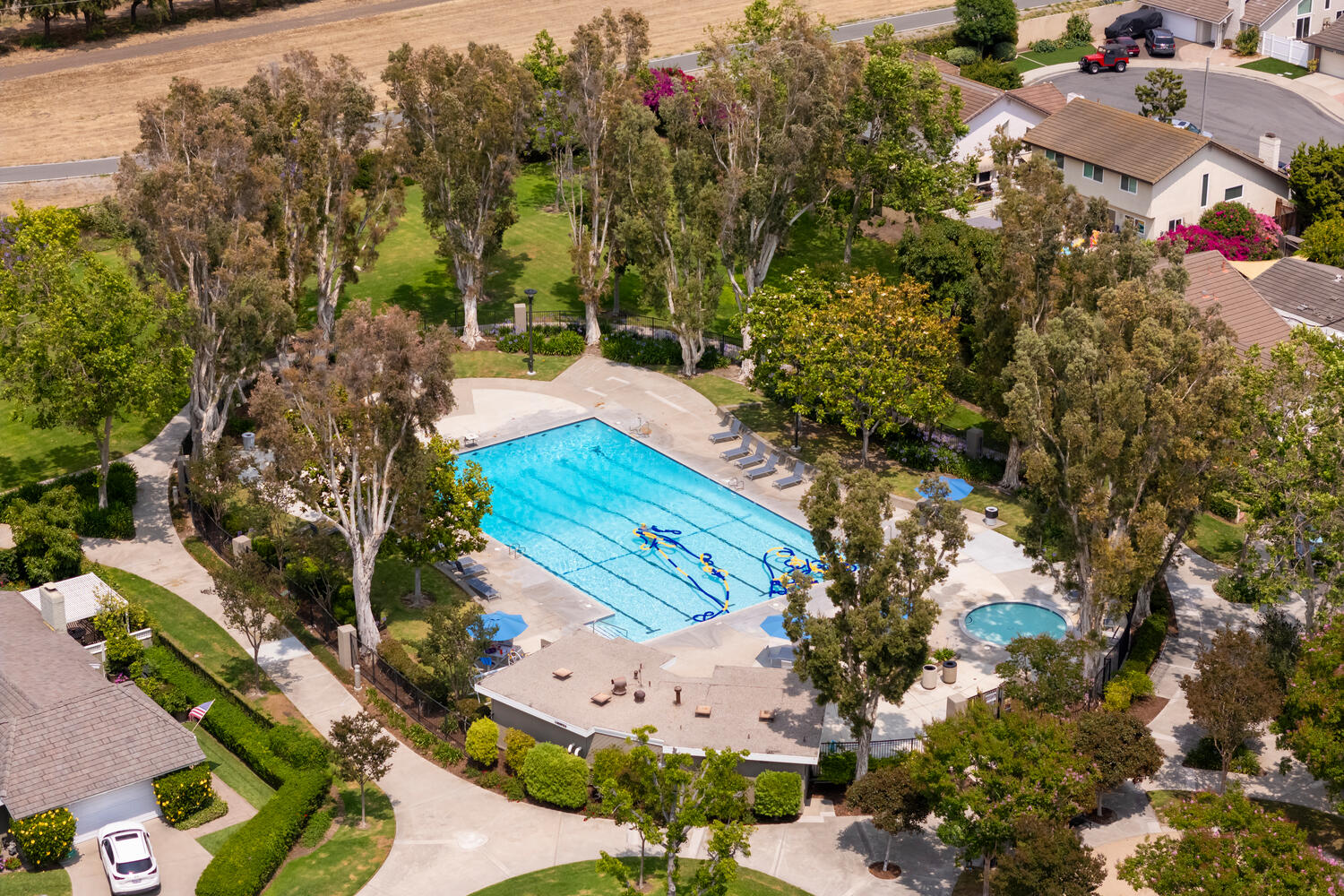 Aerial view of one of Deerfield's five community pools surrounded by mature trees
